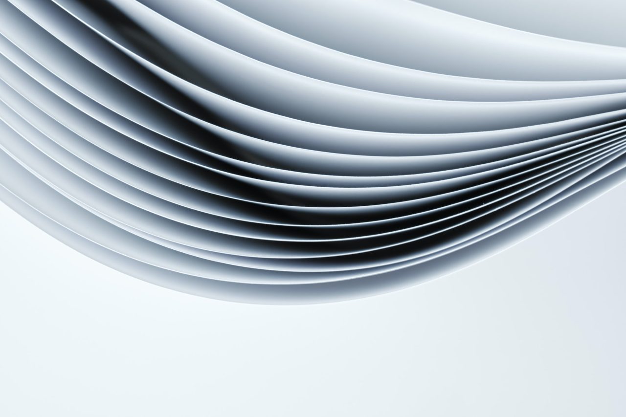 Abstract Background Sheets Of Paper Forming A Pattern Of Curved Lines .jpg